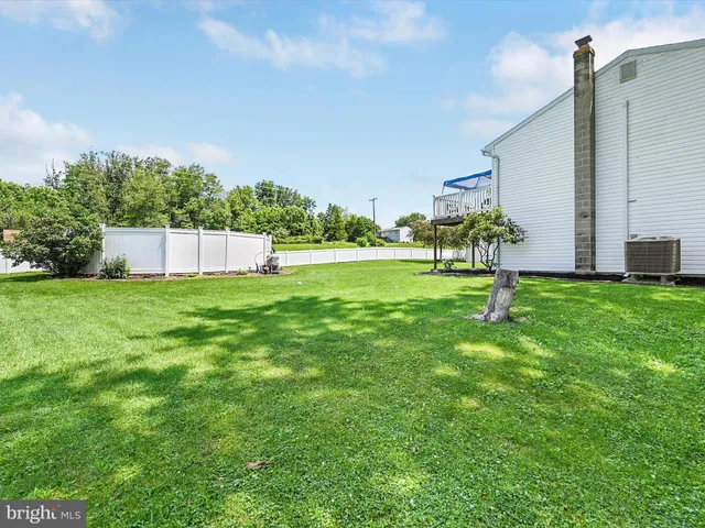 a kitchen with granite countertop a sink stainless steel appliances and cabinets