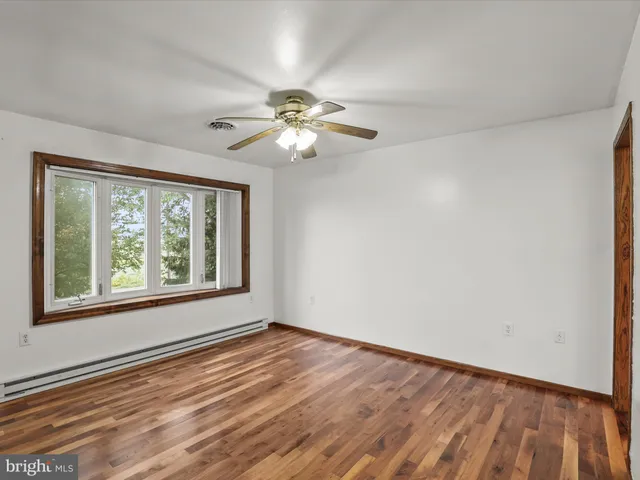a kitchen with a sink stove and microwave