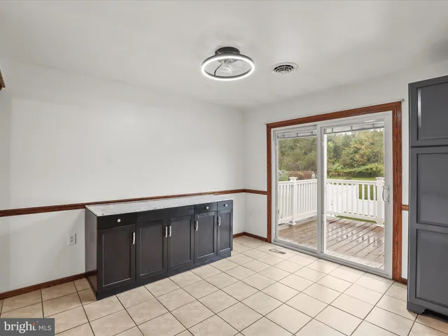 a bathroom with a sink toilet vanity and shower