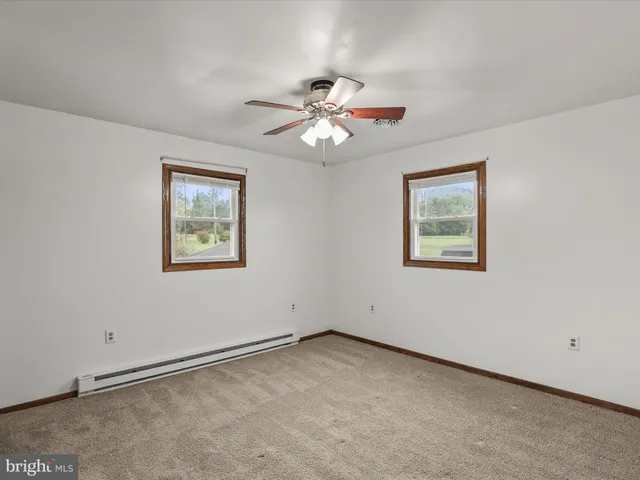 a kitchen with kitchen island granite countertop a sink counter top space appliances and cabinets