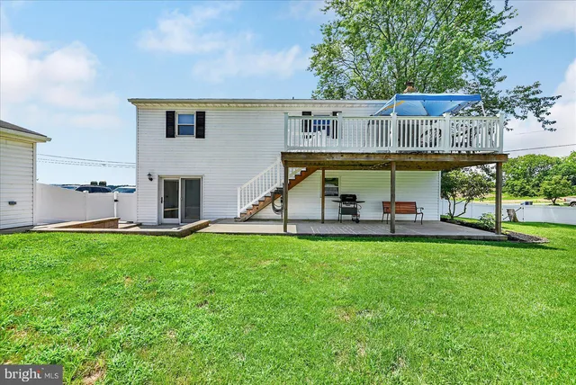 a view of a backyard with plants and a patio