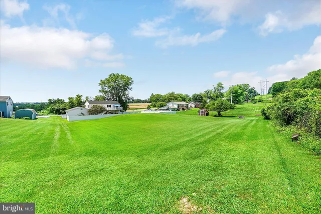 a view of a two chairs on the roof deck