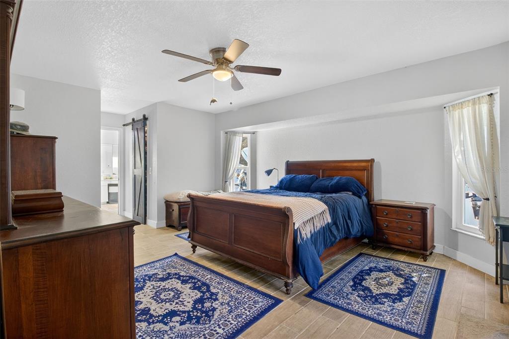 1632 Amstead Street Punta Gorda, FL 33980 - Photo 16 of 50 a bedroom with a bed dresser and a window