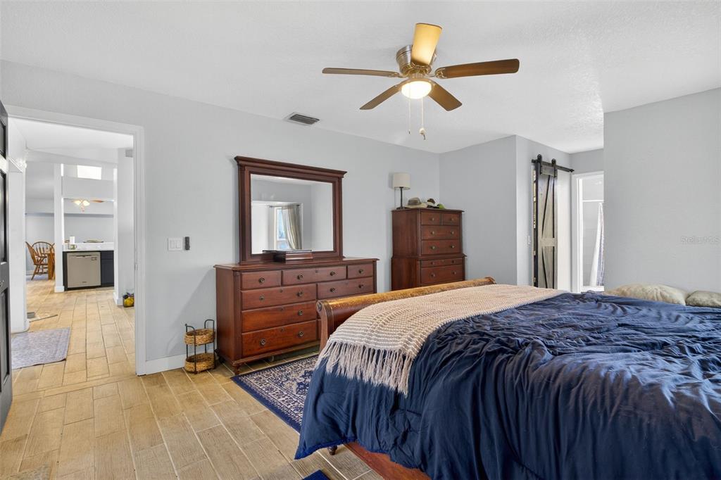 1632 Amstead Street Punta Gorda, FL 33980 - Photo 17 of 50 a bedroom with a bed and a dresser