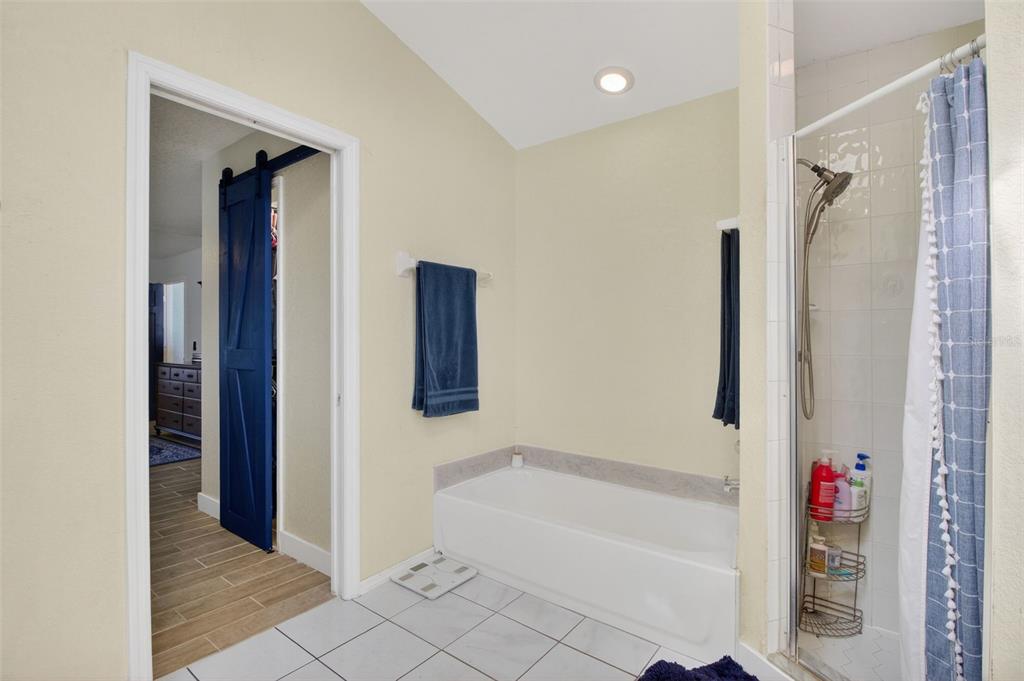 1632 Amstead Street Punta Gorda, FL 33980 - Photo 22 of 50 a bathroom with a bathtub and a shower