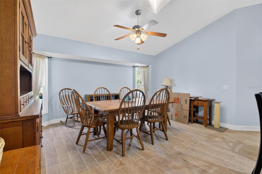 1632 Amstead Street Punta Gorda, FL 33980 - Photo 28 of 50 a view of a a dining room with furniture window and wooden floor