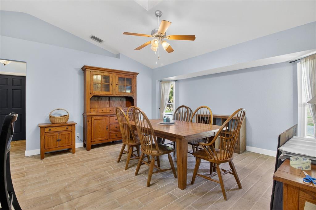 1632 Amstead Street Punta Gorda, FL 33980 - Photo 29 of 50 a view of a dining room with furniture and chandelier
