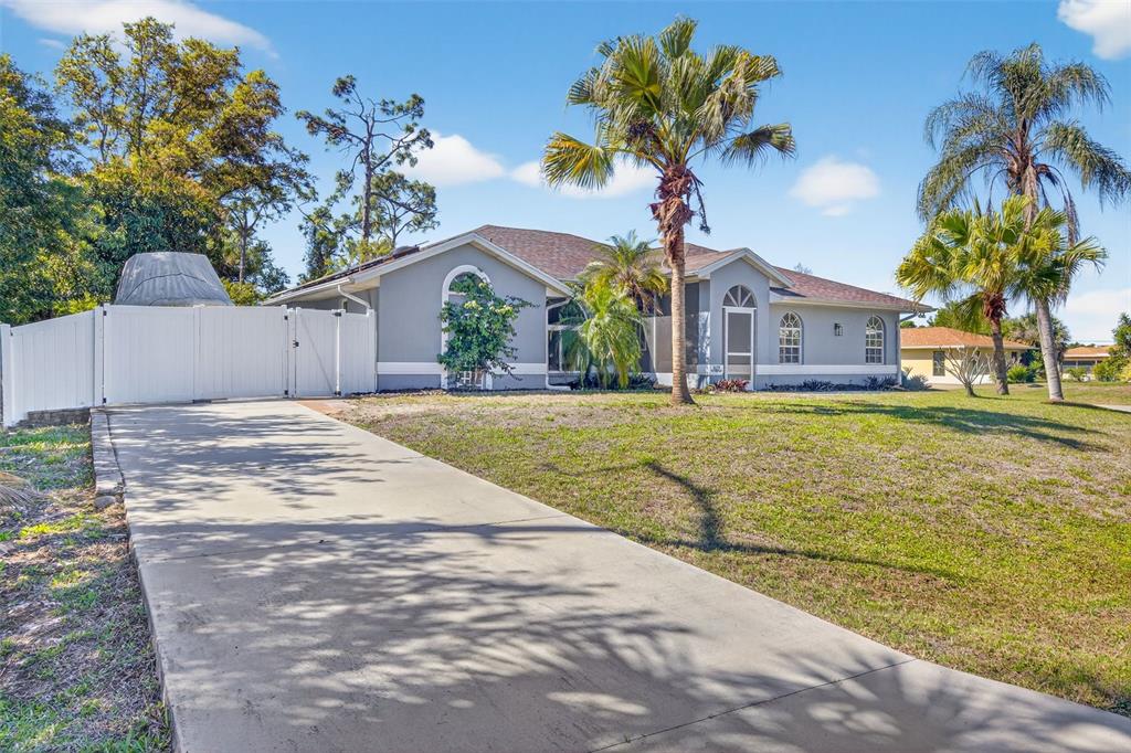 1632 Amstead Street Punta Gorda, FL 33980 - Photo 3 of 50 a front view of house with yard and green space