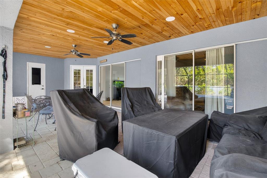 1632 Amstead Street Punta Gorda, FL 33980 - Photo 39 of 50 a living room with furniture a large window and wooden floor