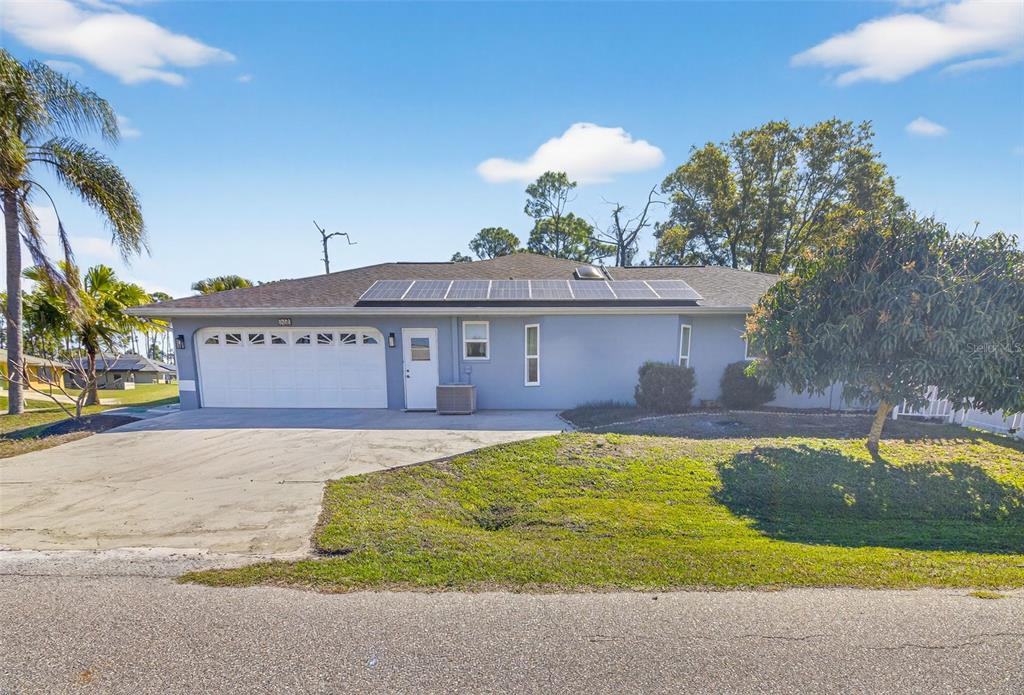 1632 Amstead Street Punta Gorda, FL 33980 - Photo 6 of 50 a view of a house with swimming pool and a yard