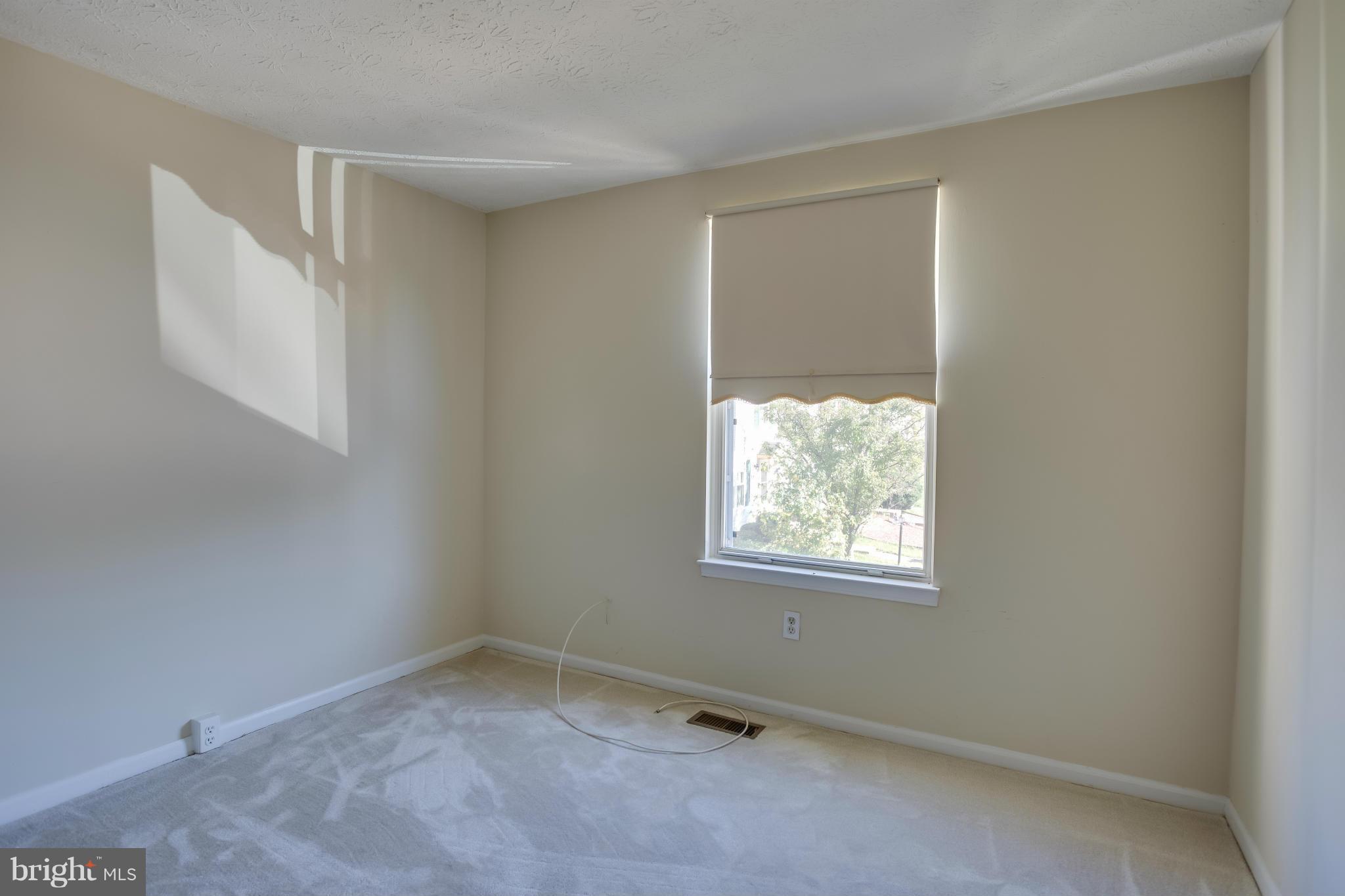 7482 Wounded Knee Road Lorton, VA 22079 - Photo 14 of 29 an empty room with windows