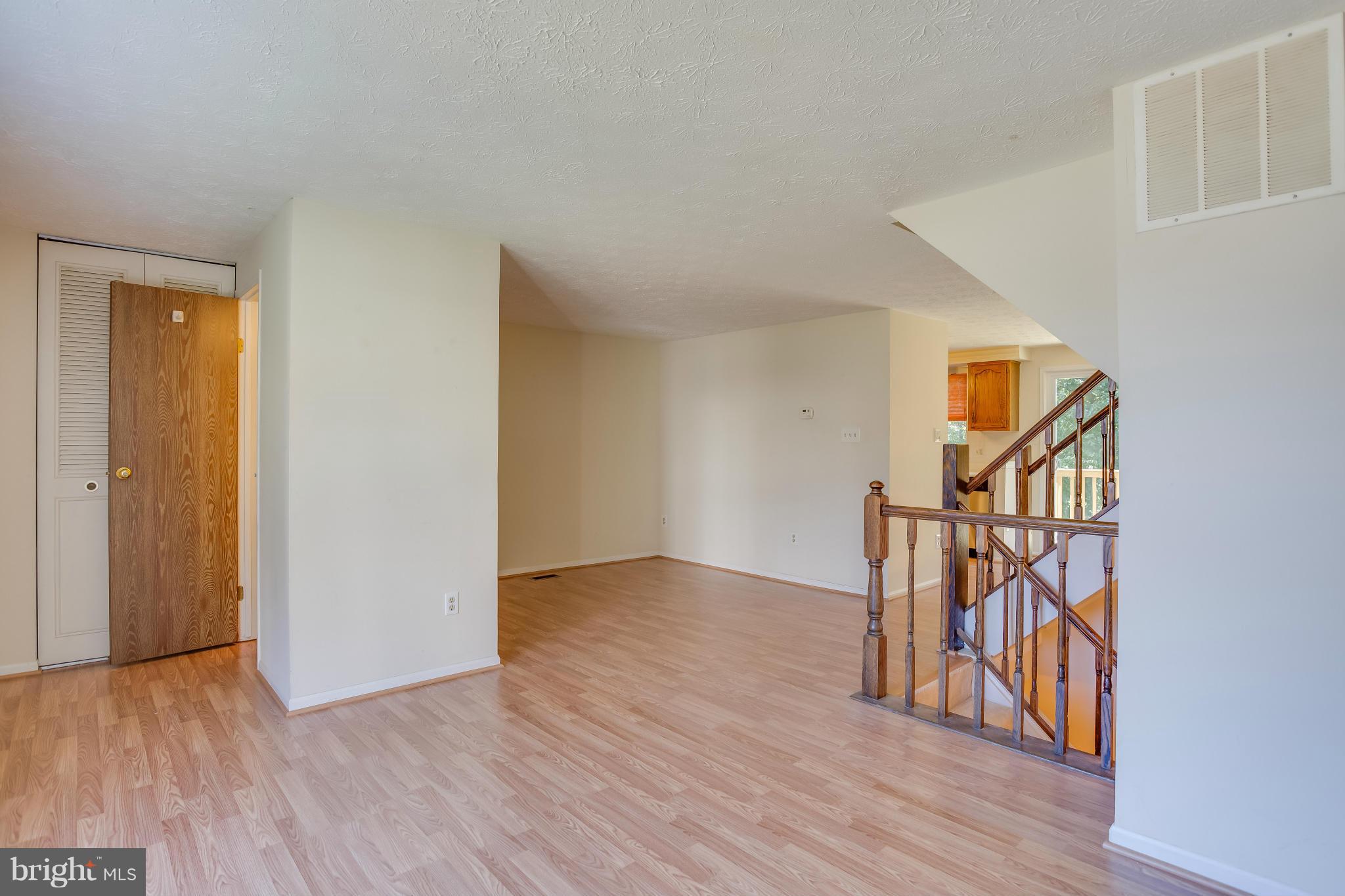 7482 Wounded Knee Road Lorton, VA 22079 - Photo 3 of 29 a view of an entryway with wooden floor