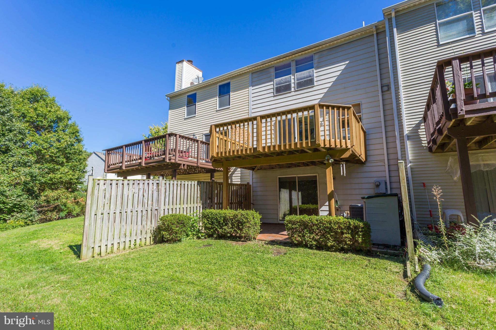 7482 Wounded Knee Road Lorton, VA 22079 - Photo 26 of 29 a view of a house with a yard and plants