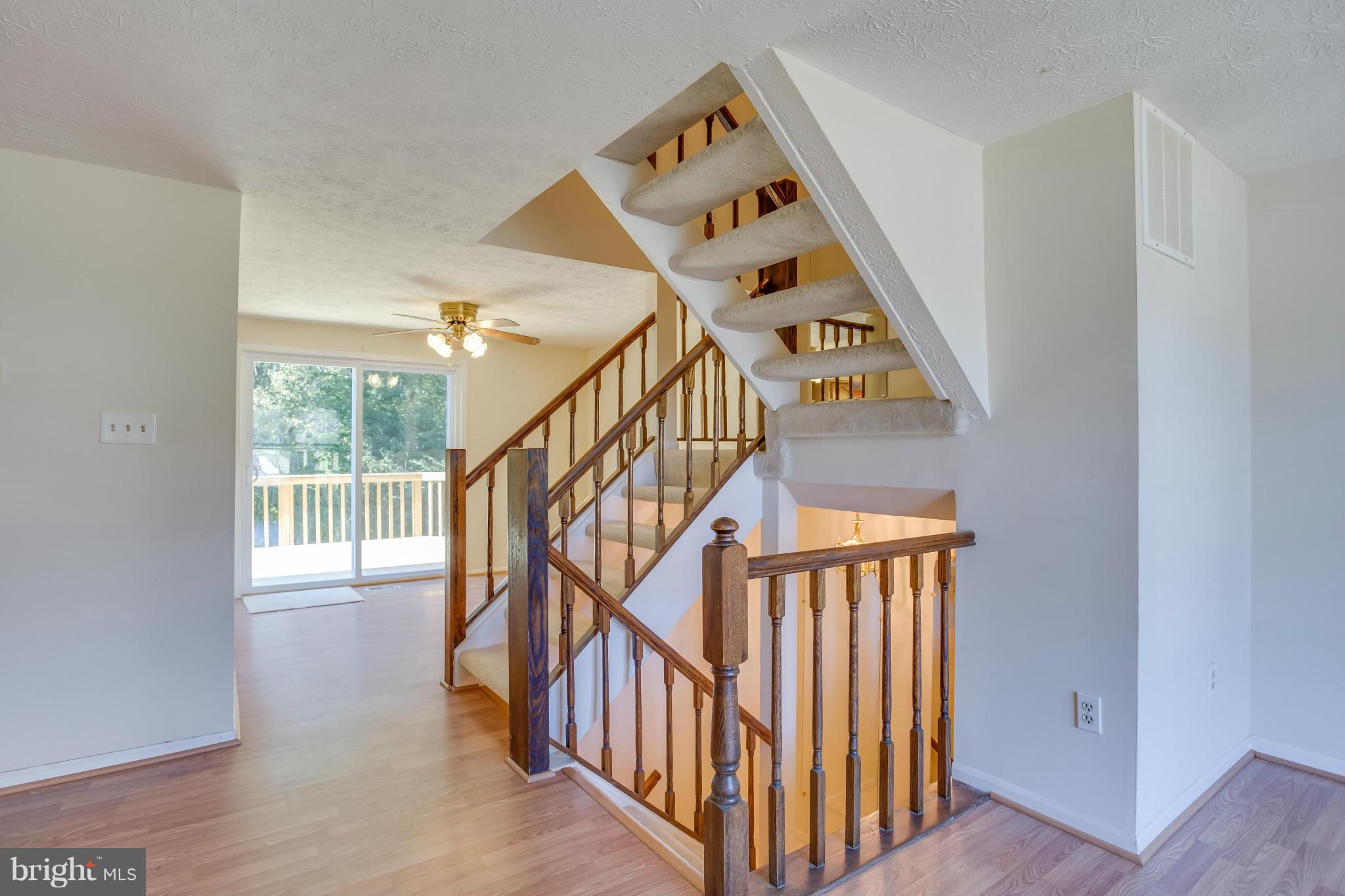 7482 Wounded Knee Road Lorton, VA 22079 - Photo 5 of 29 a view of entryway and hall with wooden floor