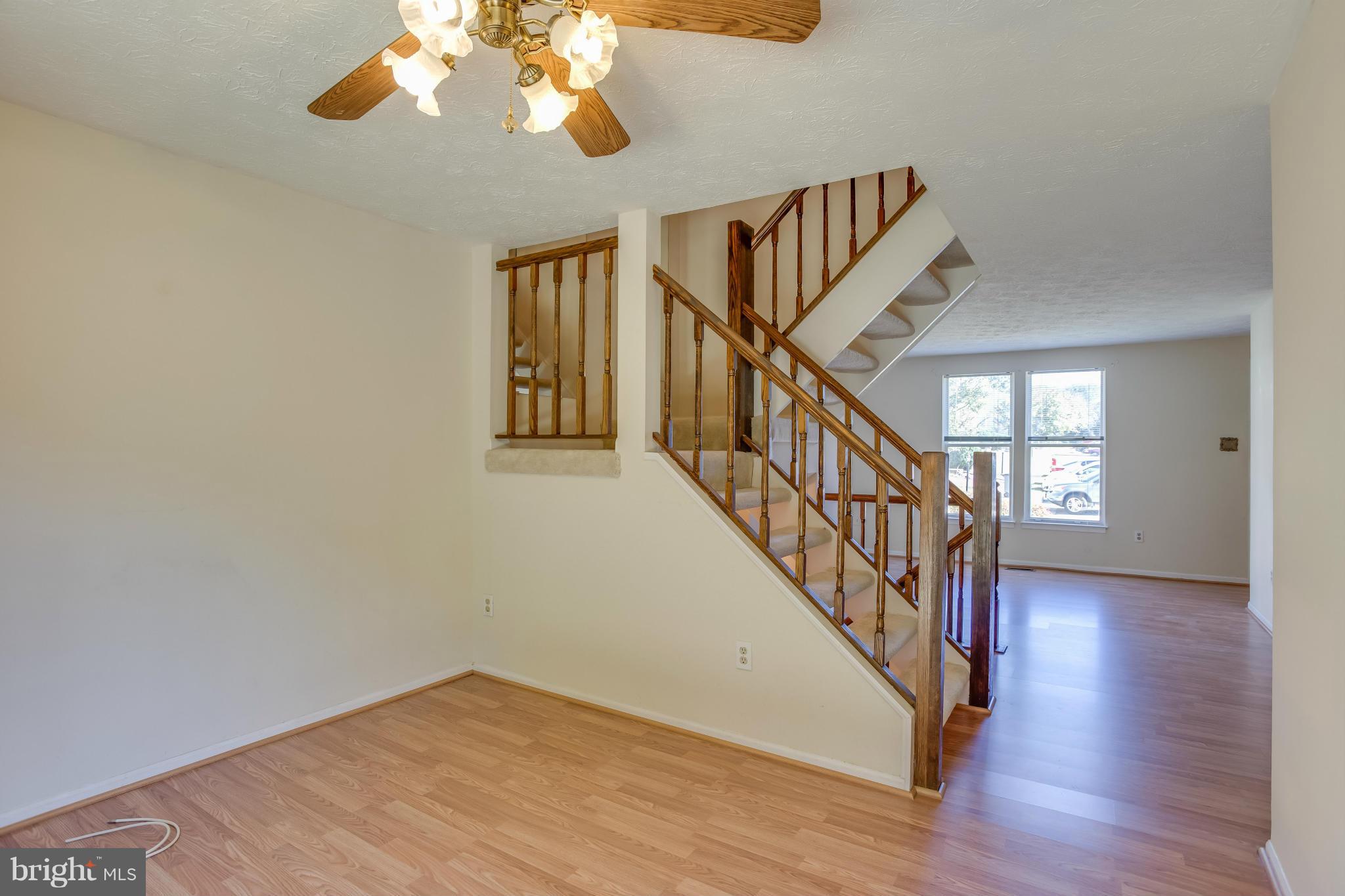 7482 Wounded Knee Road Lorton, VA 22079 - Photo 6 of 29 a view of an entryway with wooden floor