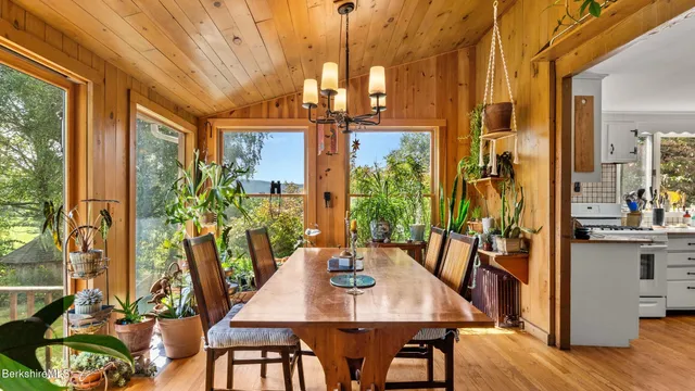 a view of a dining room with furniture window and outside view