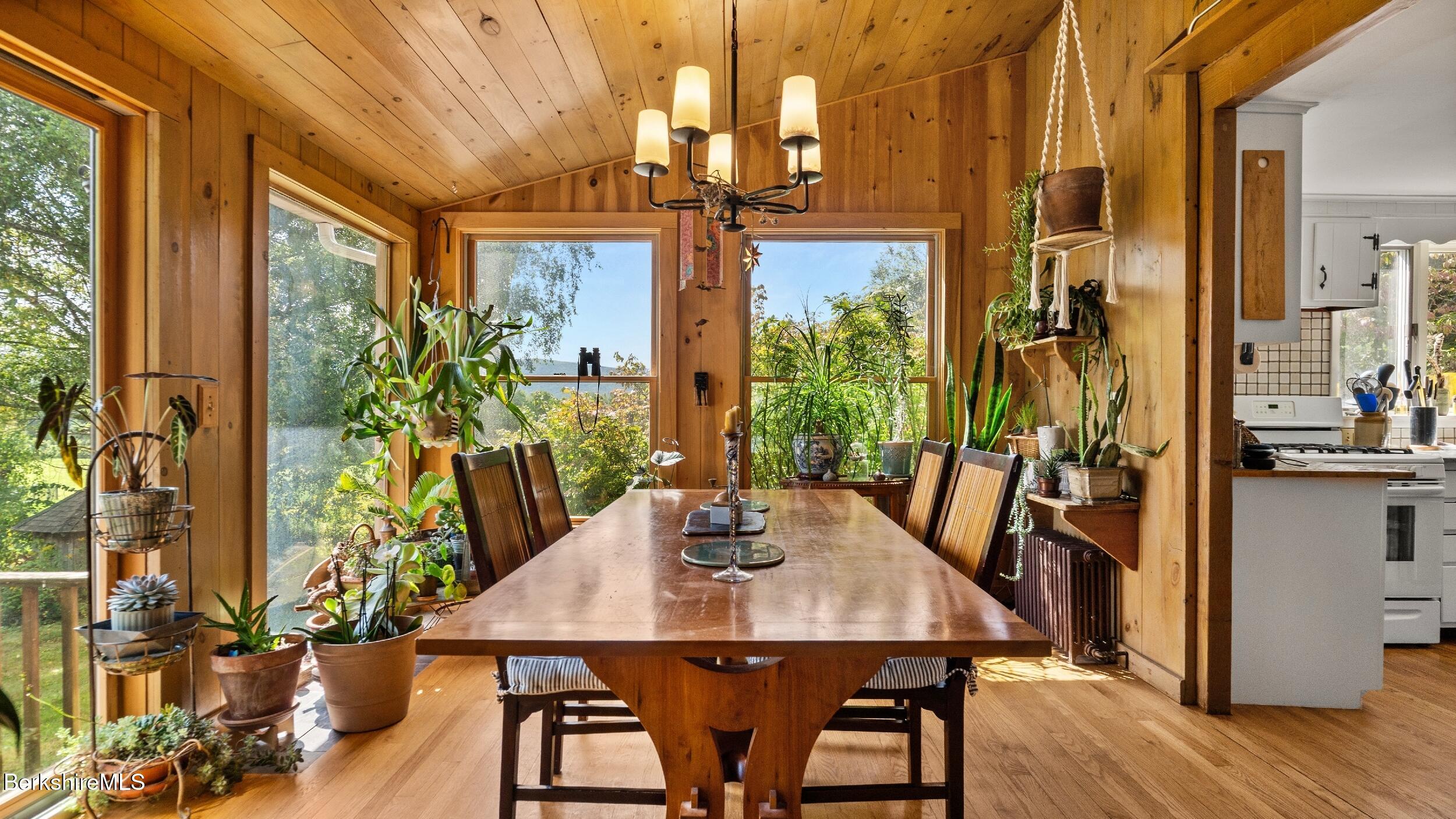 115 Baldwin Hill Road South Egremont, MA 01230 - Photo 16 of 36 a view of a dining room with furniture window and wooden floor