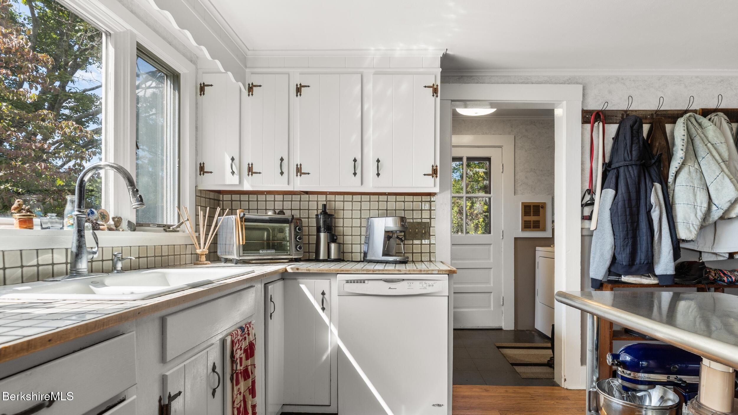 115 Baldwin Hill Road South Egremont, MA 01230 - Photo 25 of 36 a kitchen with stainless steel appliances a sink stove and cabinets