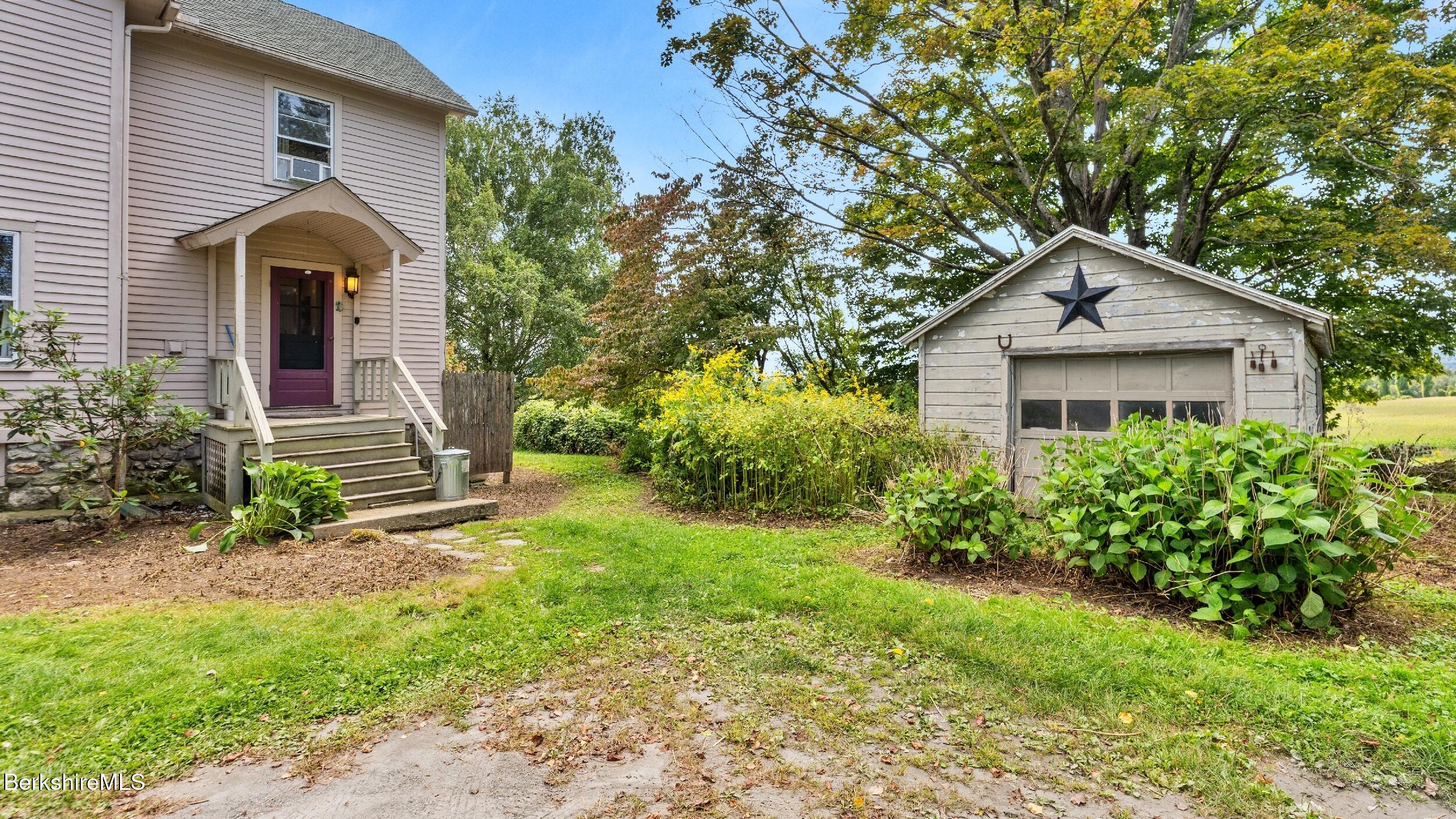 115 Baldwin Hill Road South Egremont, MA 01230 - Photo 3 of 36 a front view of a house with garden