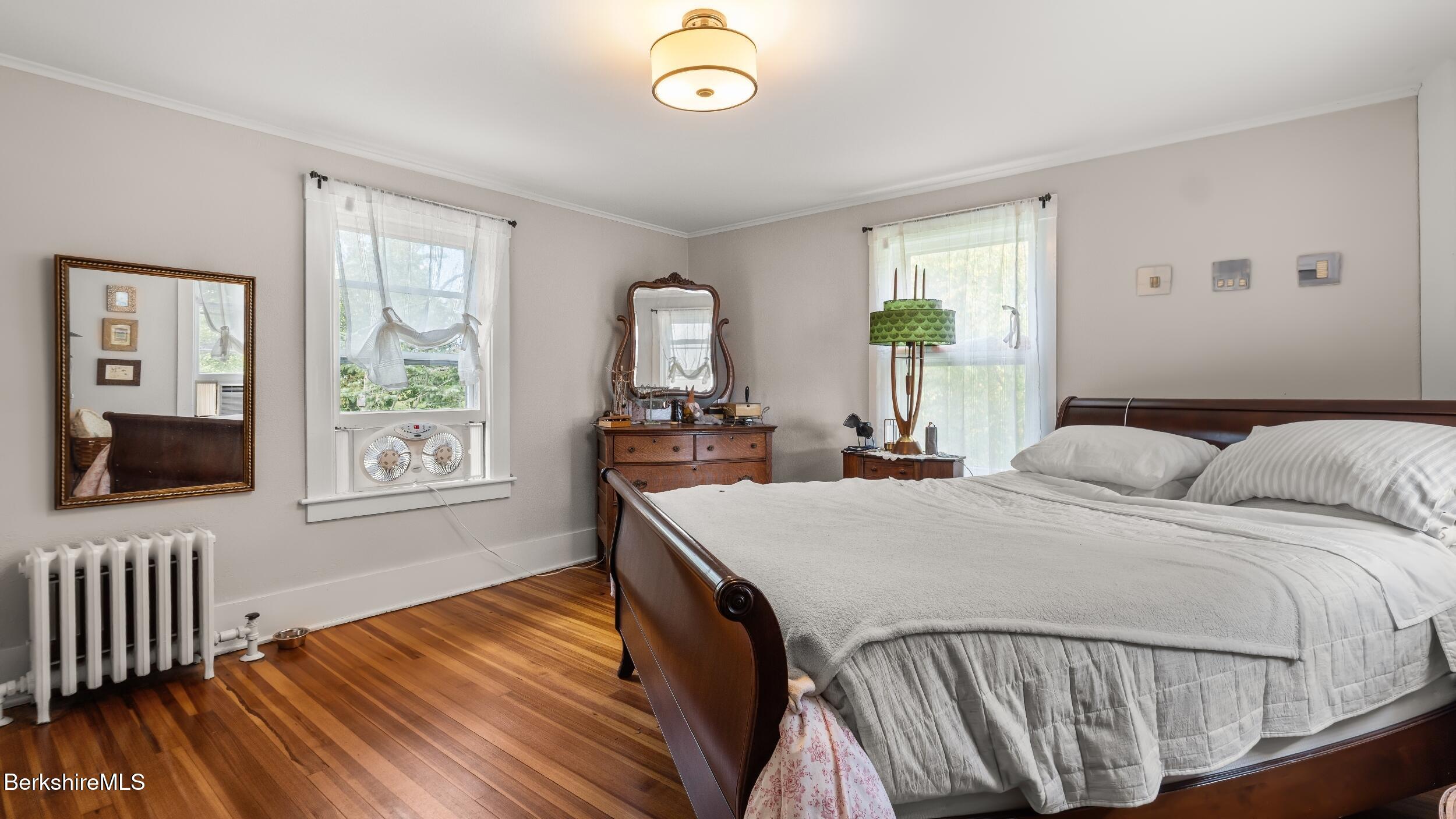 115 Baldwin Hill Road South Egremont, MA 01230 - Photo 36 of 36 a bedroom with a bed and wooden floor