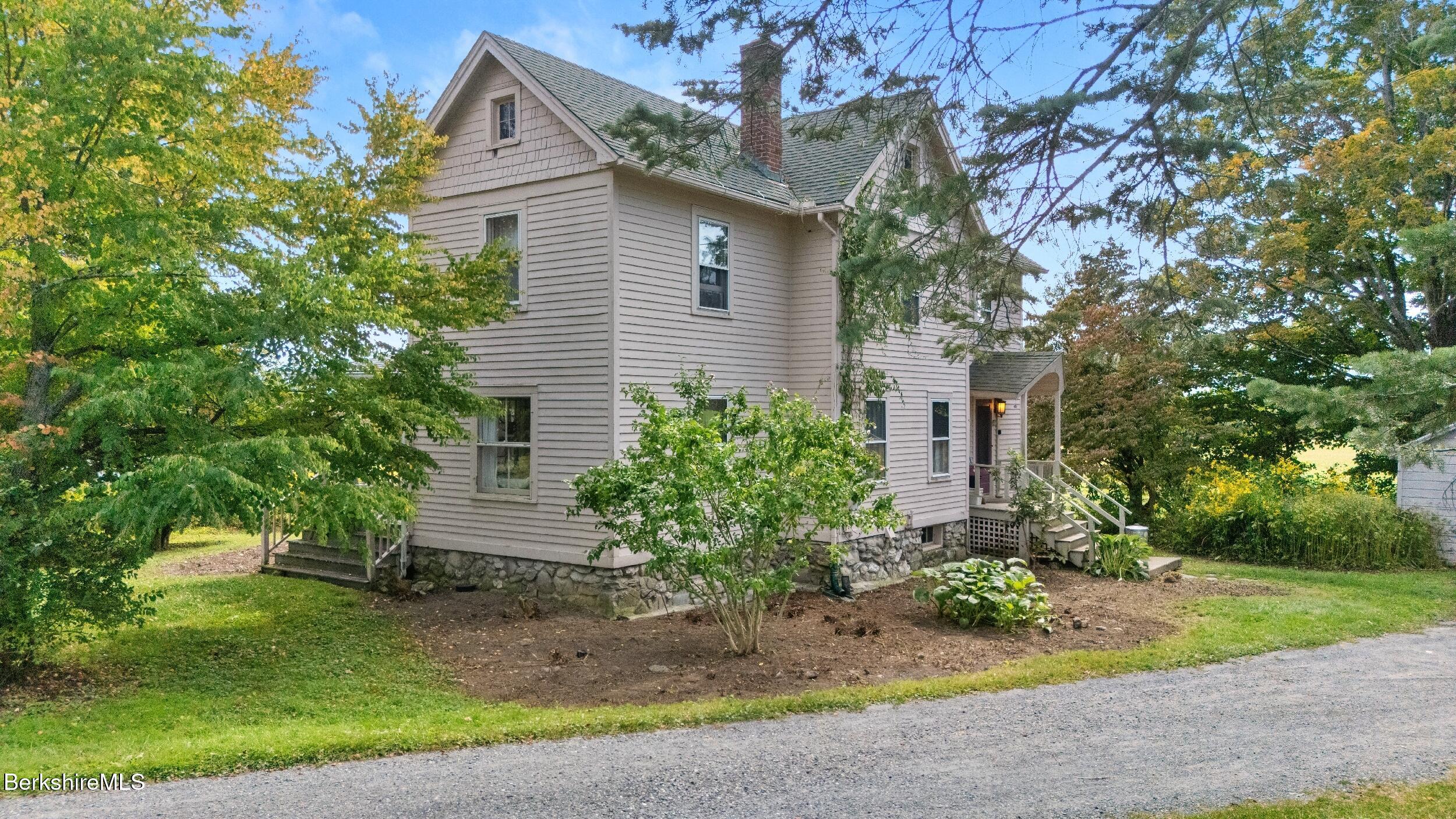 115 Baldwin Hill Road South Egremont, MA 01230 - Photo 6 of 36 a front view of a house with garden