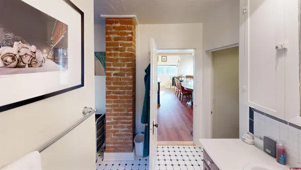 a view of hallway with walk in closet and bedroom