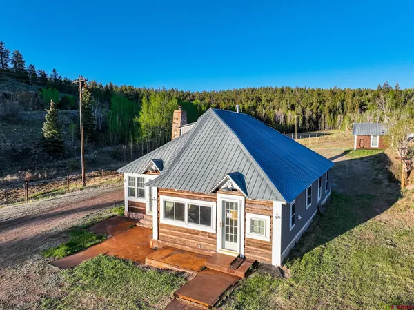 a house with trees in the background