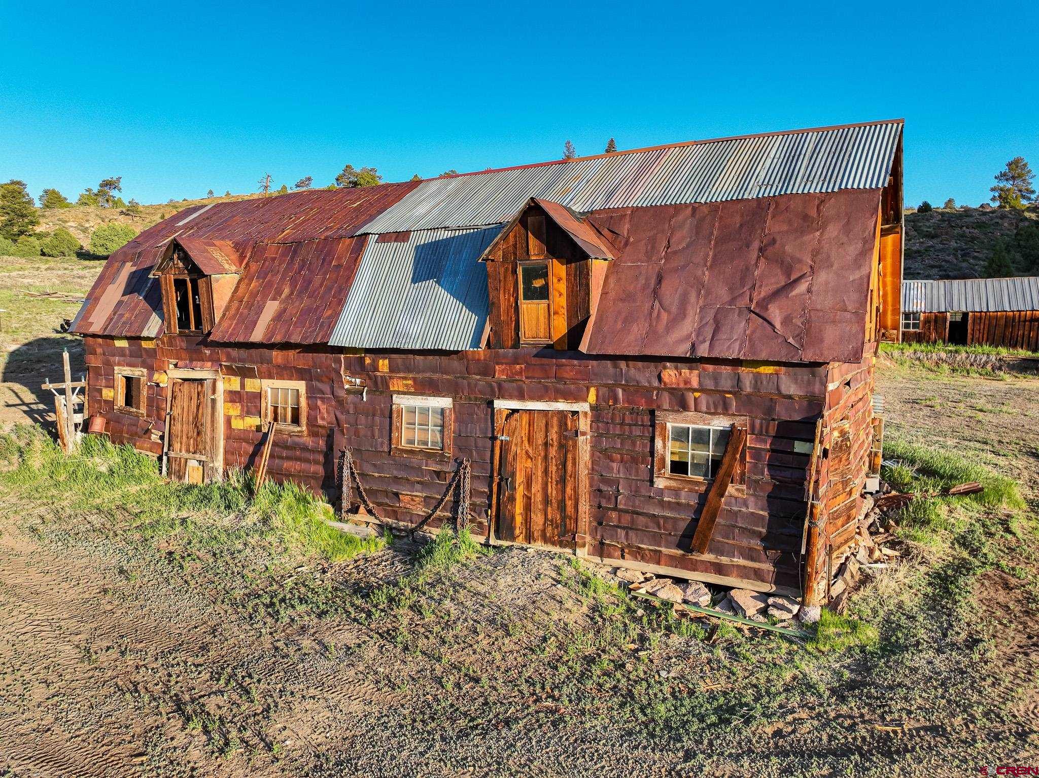 16431 Highway 149 Powderhorn, CO 81243 - Photo 5 of 24 a view of a back yard of the house
