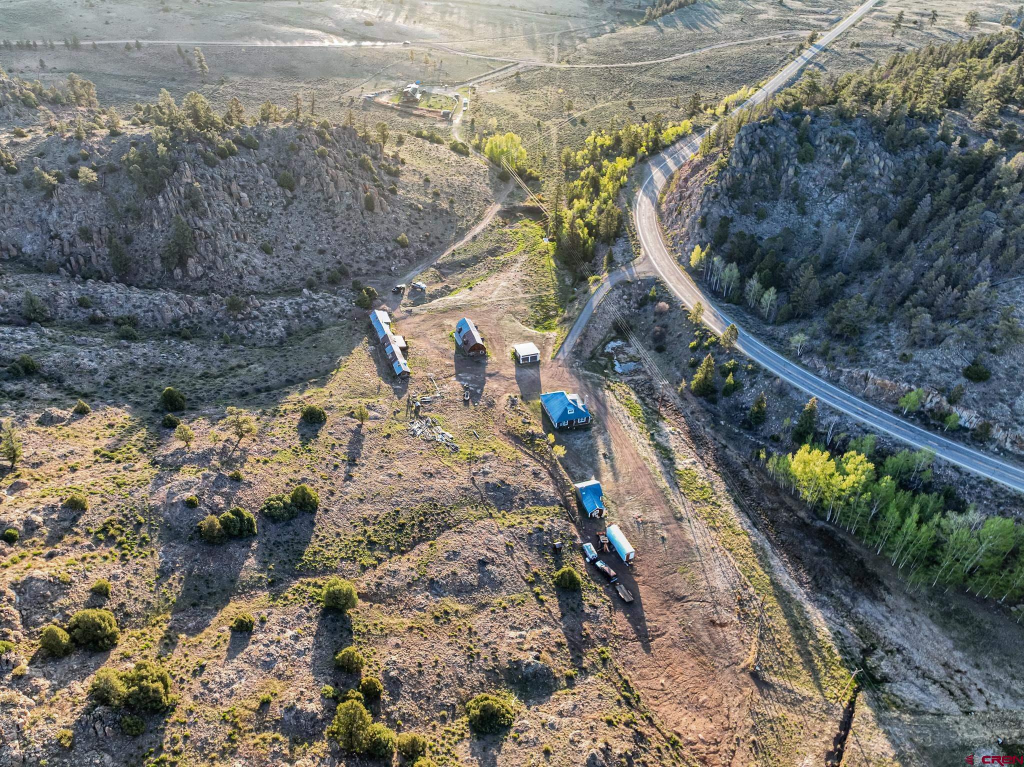 16431 Highway 149 Powderhorn, CO 81243 - Photo 7 of 24 a view of a yard with wooden fence