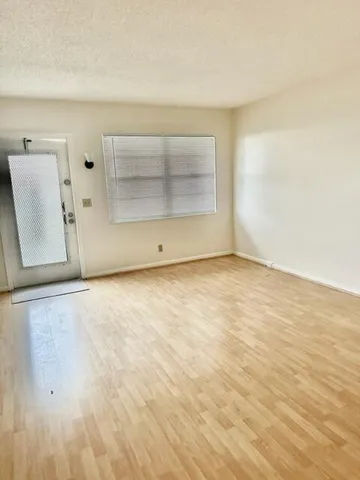 an empty room with a fireplace