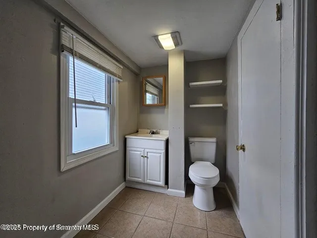 a bathroom with a toilet and a sink