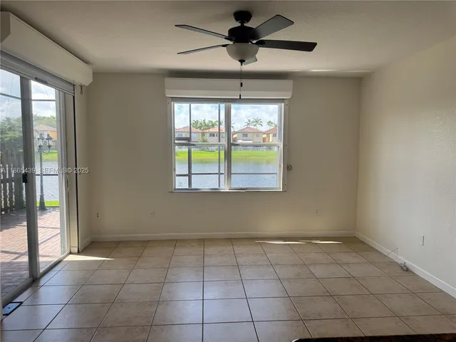 a view of an empty room and a window