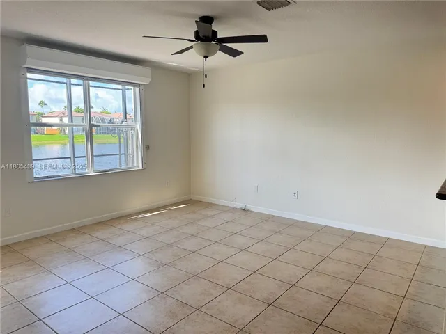 a kitchen with stainless steel appliances granite countertop a refrigerator and a stove
