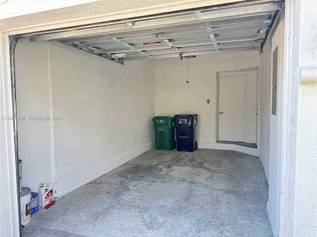 a bedroom with bed and window