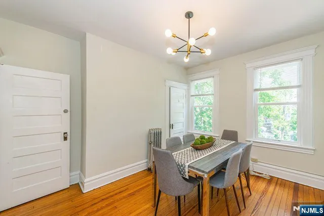 a view of a hallway view with wooden floor and bedroom