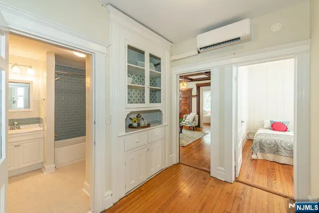 a view of an entryway with wooden floor and door