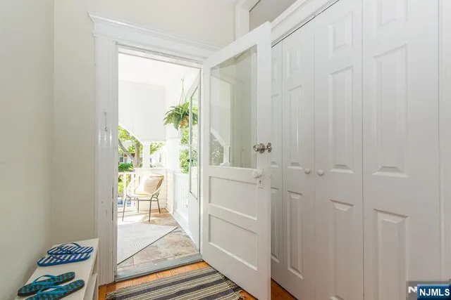 a view of a chair and table in the balcony