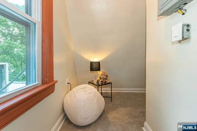 a picture of a book and a couple of white wall