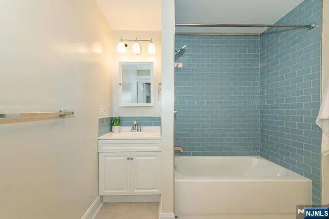 a bathroom with a toilet and a bathtub