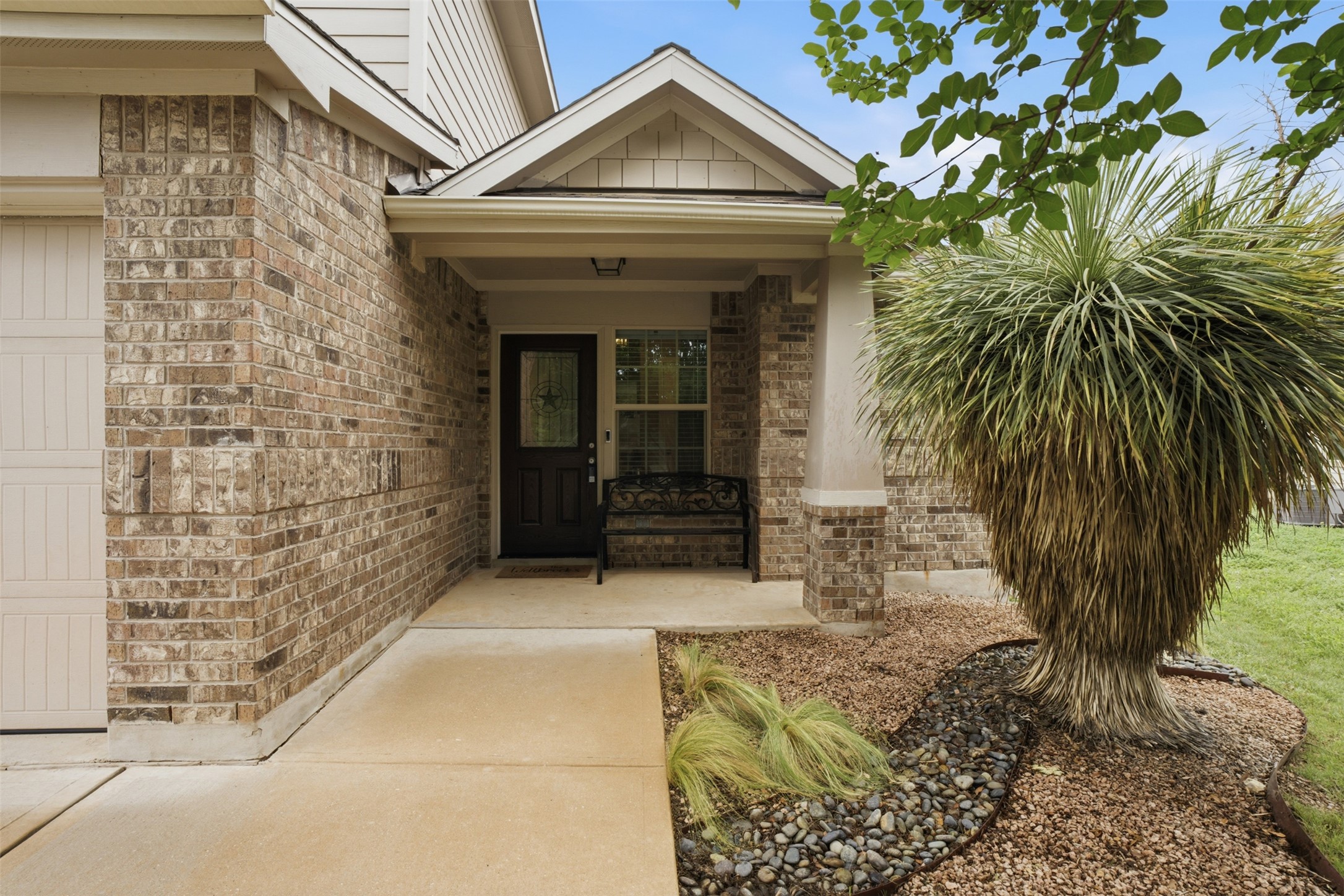 137 Barn Owl Loop Leander, TX 78641 - Photo 3 of 36 a view of entryway with garden