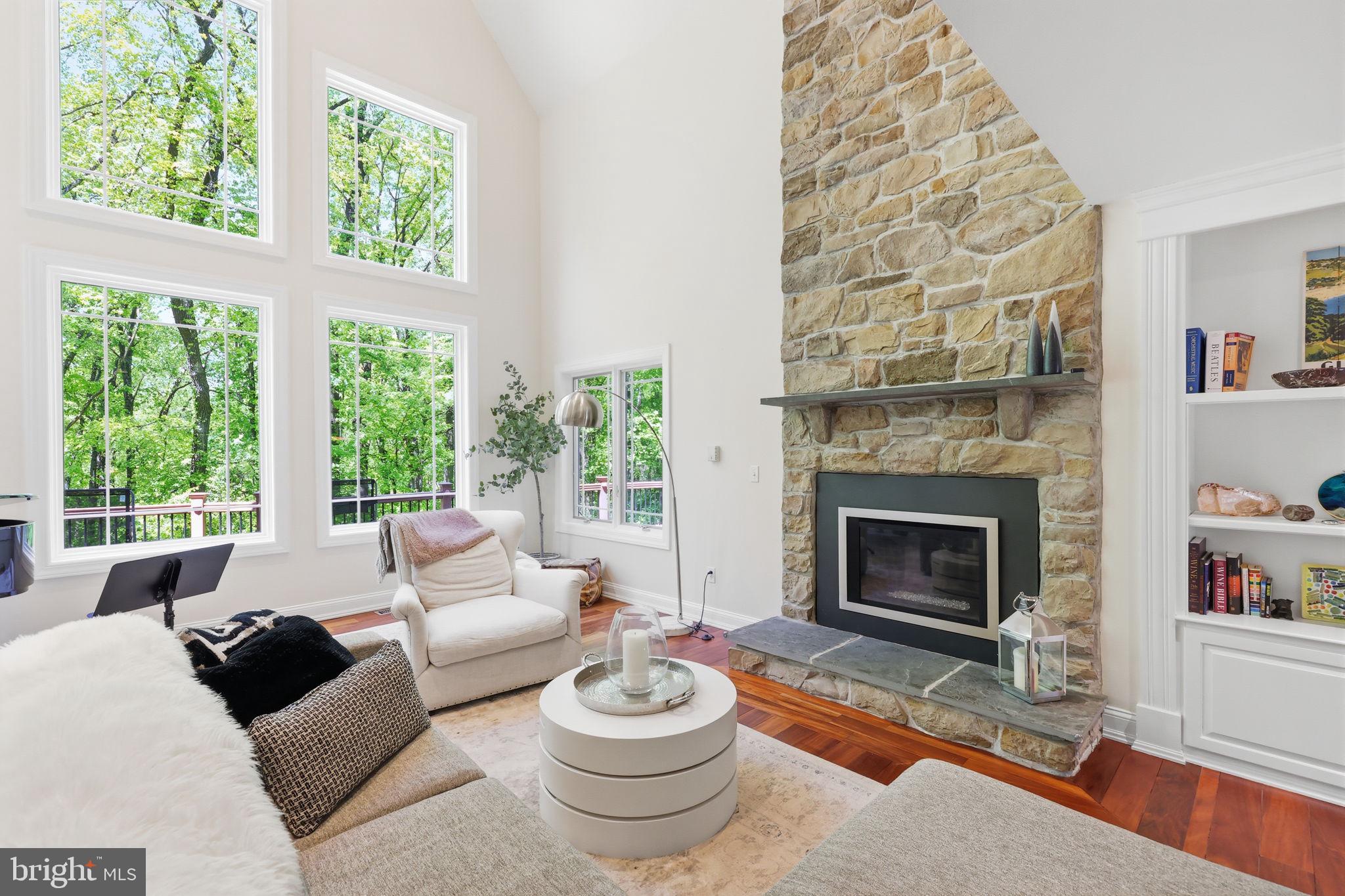 4757 Upper Mountain Road New Hope, PA 18938 - Photo 3 of 70 a living room with furniture a fireplace and a large window