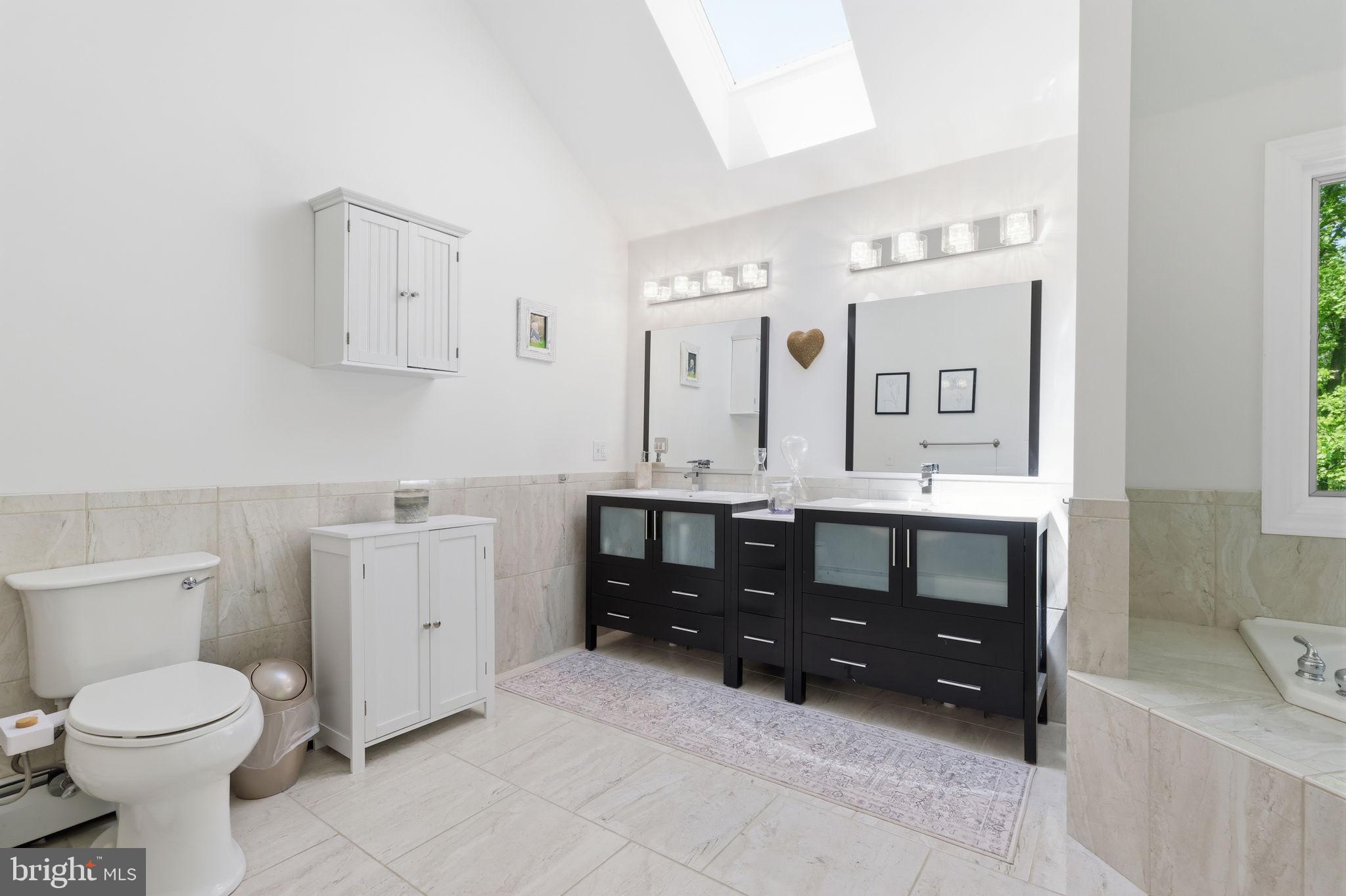 4757 Upper Mountain Road New Hope, PA 18938 - Photo 37 of 70 a bathroom with a sink vanity mirror and toilet