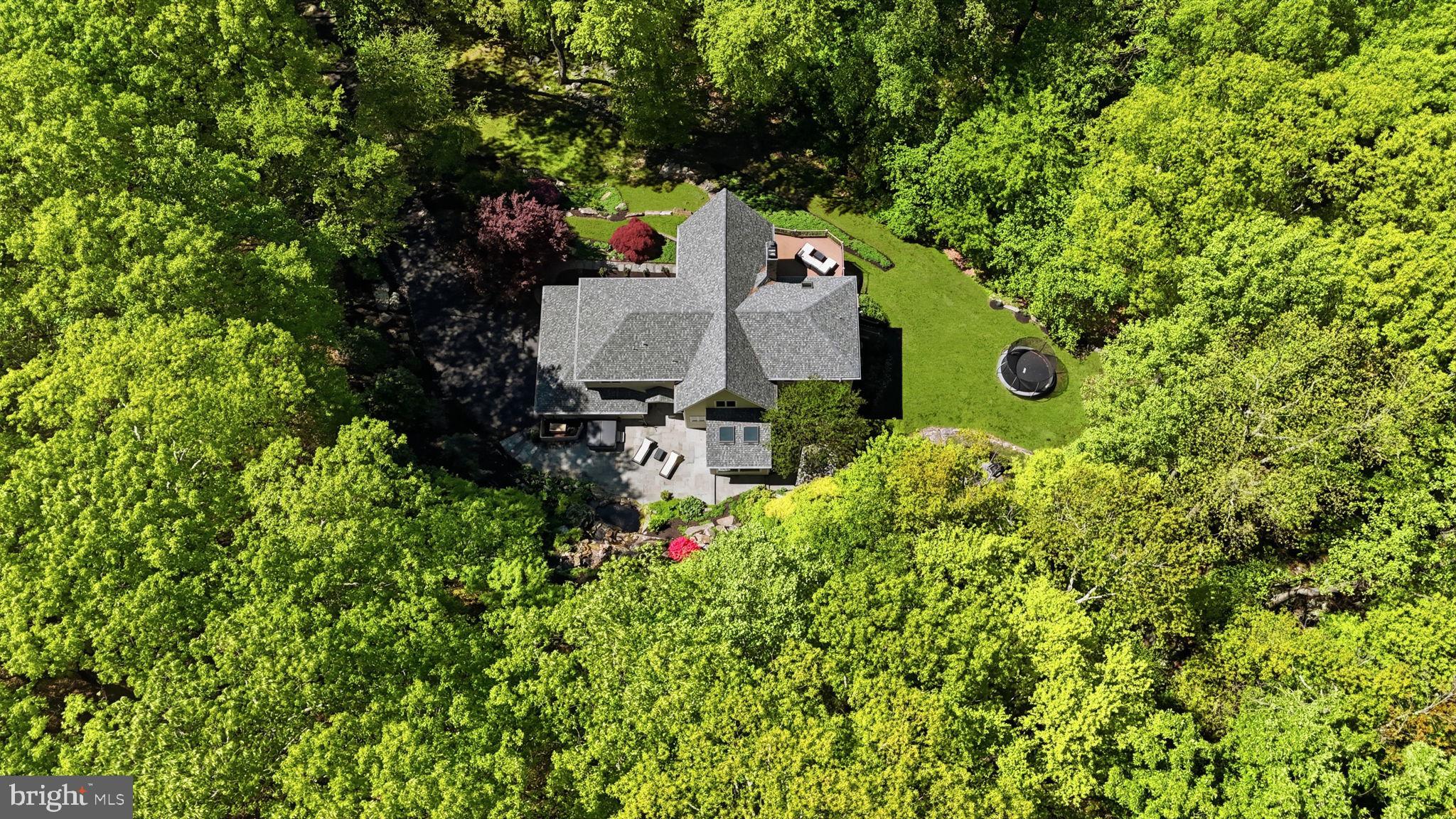 4757 Upper Mountain Road New Hope, PA 18938 - Photo 68 of 70 an aerial view of a house with a yard and trees