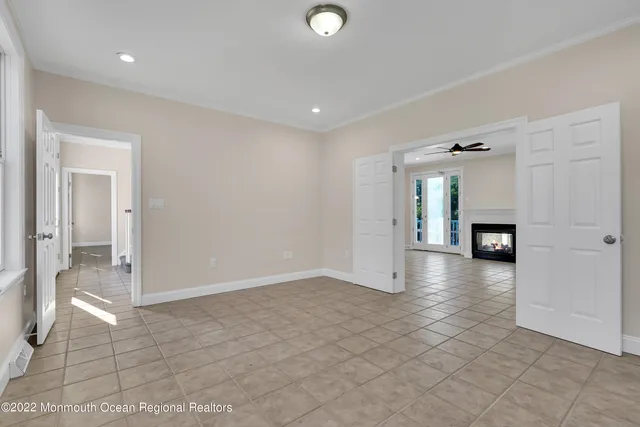 a bathroom with a sink vanity granite toilet and a mirror