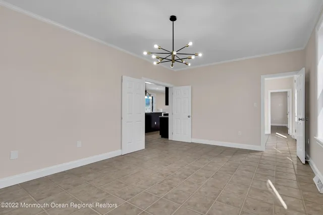 a view of a room with a fireplace and window