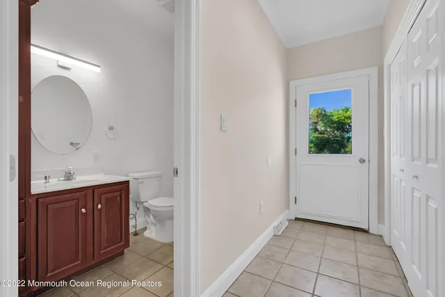 a kitchen with stainless steel appliances granite countertop a sink a stove and refrigerator