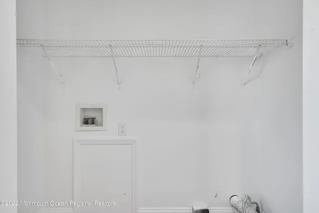 a view of a livingroom with a fireplace and window