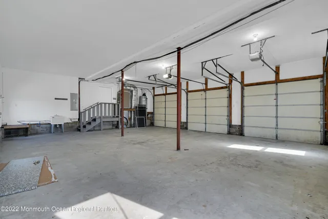 a view of a hallway with wooden floor and entryway