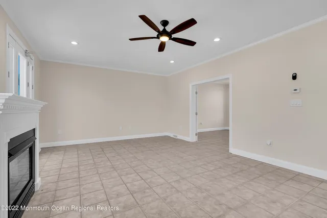 a bathroom with a tub a mirror and a shower