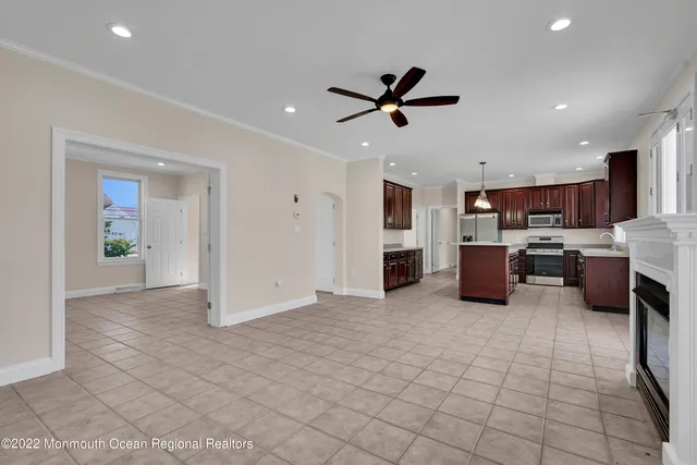 a view of an empty room with a ceiling fan